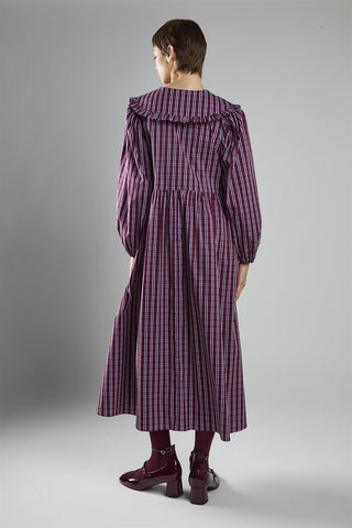 Gothcore long purple checked dress against a grey background  Jenna Ortega inspired dress 