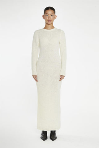 beige bodycon knitted maxi-dress with a crew neck and long sleeves. wardrobe essentials